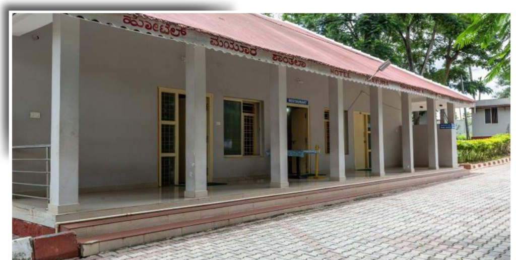 “Peaceful retreat at Karnataka Tourism Hotels, blending nature and comfort.”